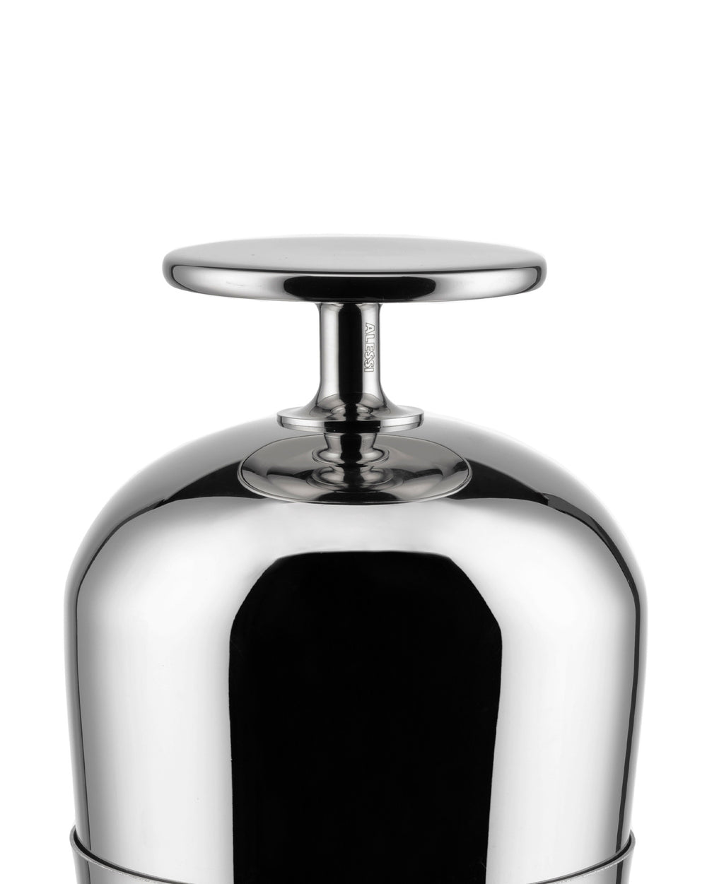 Polished metal Tending Box lid by Alessi with a flat circular handle and engraved logo on the stem.