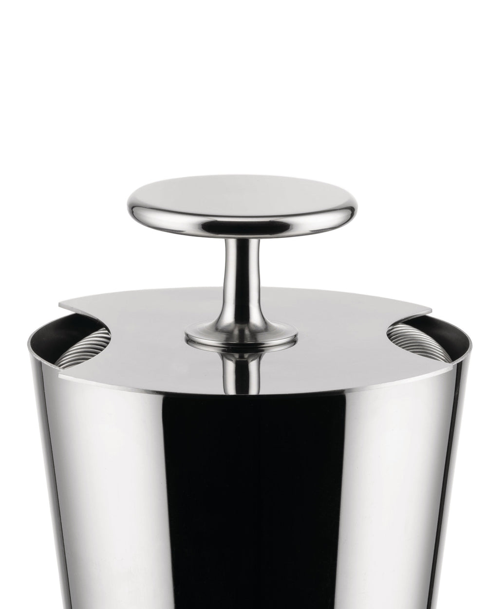 Polished metal tending box by Alessi with a sleek T-bar handle and side cut-outs revealing internal coils.