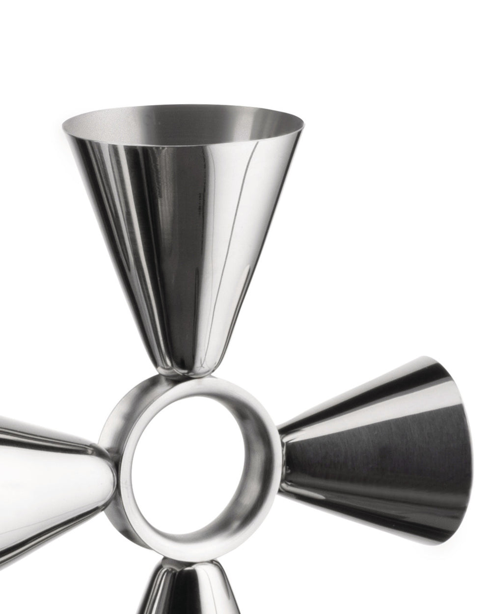 The tending box by Alessi, a shiny silver metal multi-jigger with four conical cups and a central ring on white.