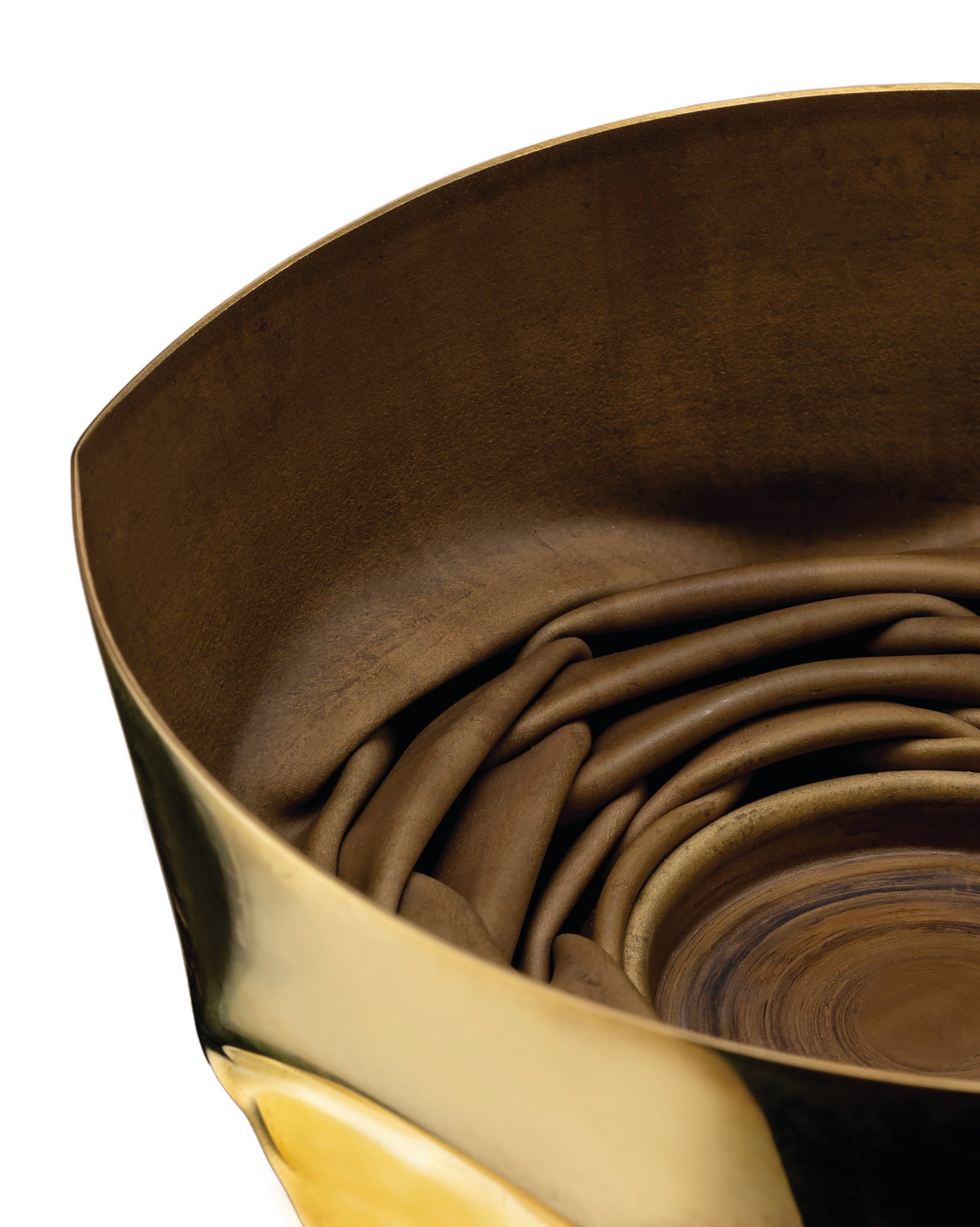 Golden and bronze sculptural container by Alessi with a deeply folded, matte interior texture.