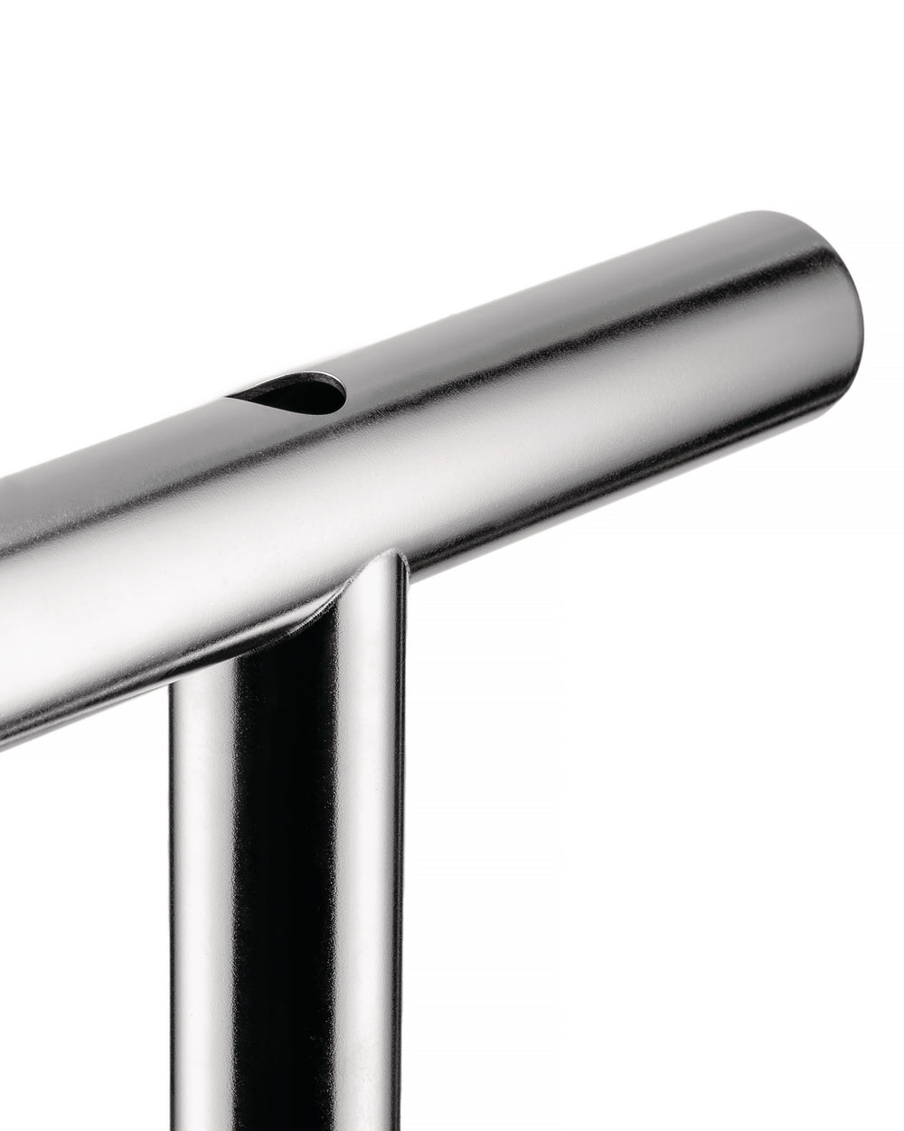 Silver metal vase by Alessi, with a tear-drop opening and sleek cylindrical design.