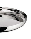 Polished chrome serving tray by Alessi, with a highly reflective surface and smooth, curved edges, partial view.