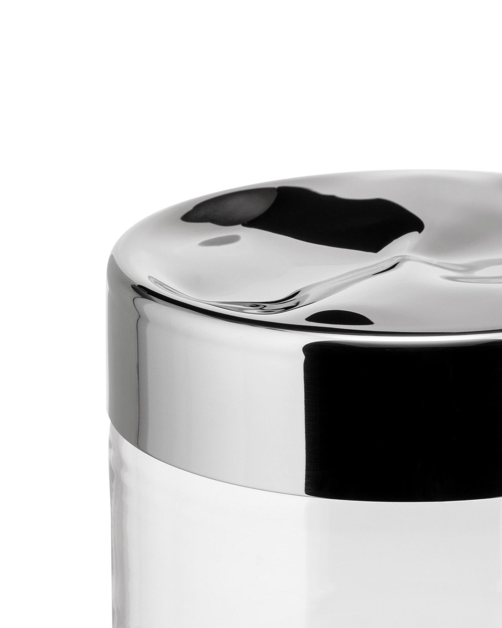Clear glass storage jar by Alessi with a polished chrome wavy, sculptural lid.