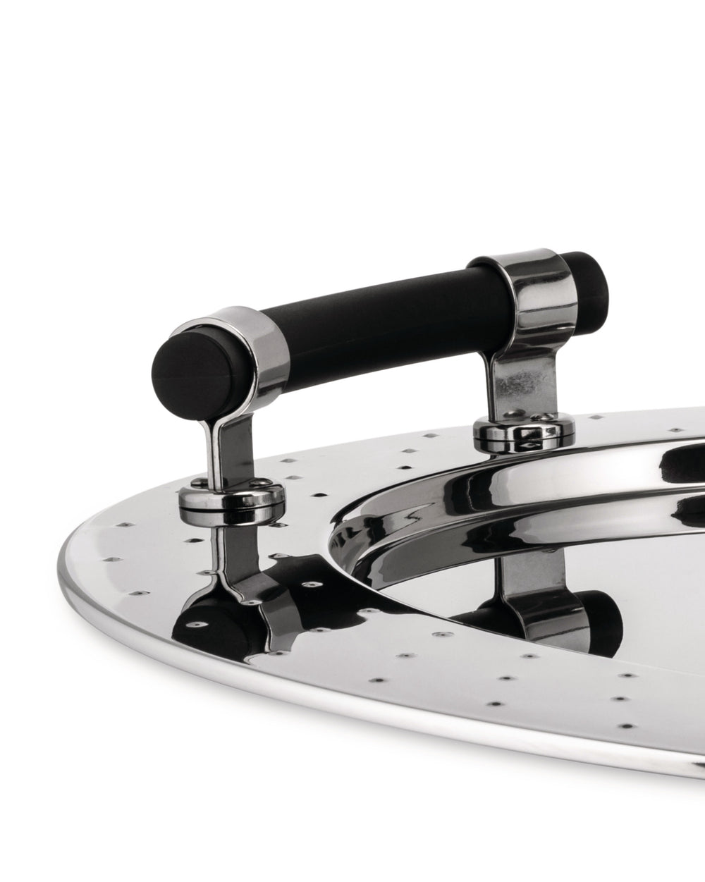 Shiny stainless steel food press with a black handle by Alessi, featuring small perforations, viewed from an angle.