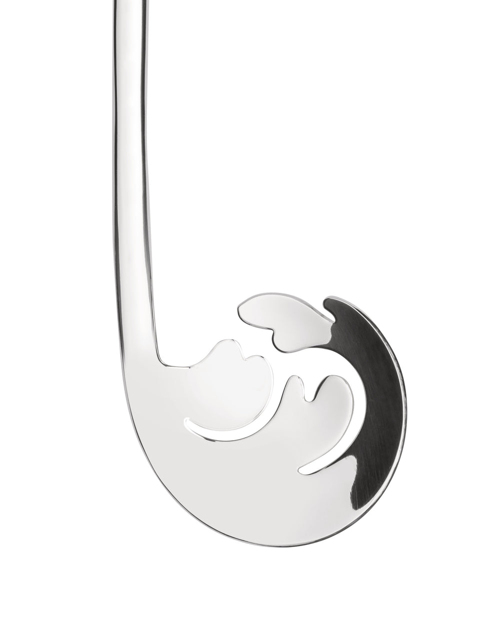 Silver metal pasta server by Alessi, with an abstract swirl design and draining cut-outs, close-up.