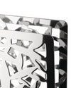 Polished metal holder with Cactus! design by Alessi, featuring intricate geometric cut-outs, close-up.