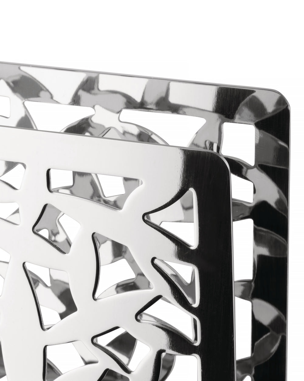 Polished metal holder with Cactus! design by Alessi, featuring intricate geometric cut-outs, close-up.