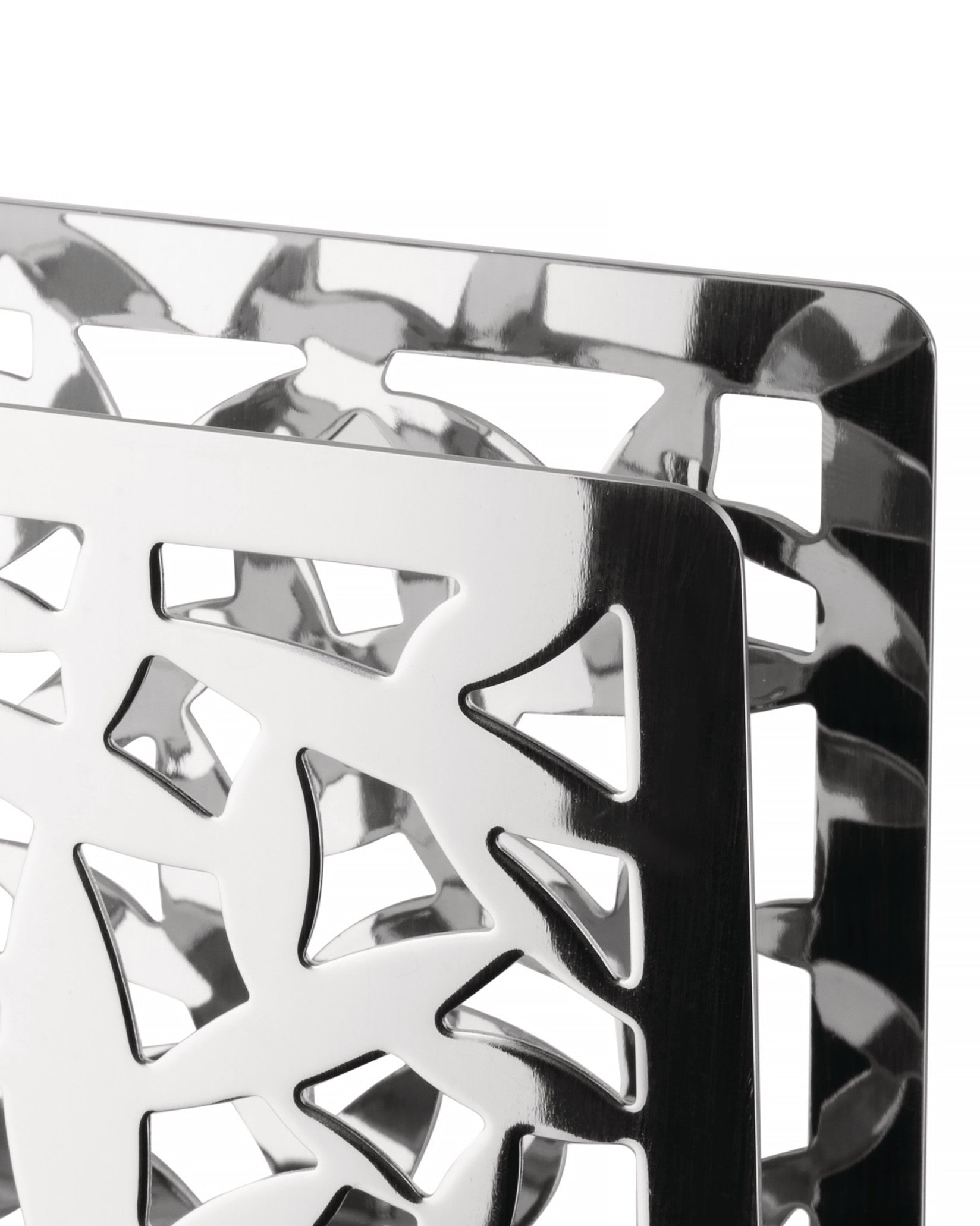 Polished metal holder with Cactus! design by Alessi, featuring intricate geometric cut-outs, close-up.