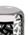 Polished silver metal cheese cellar by Alessi, featuring a geometric cut-out pattern on the side in a close-up.