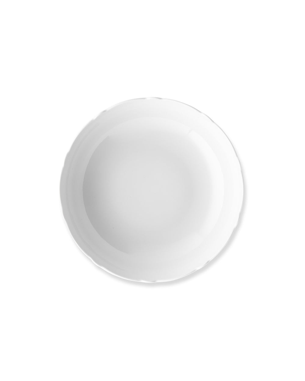 White glossy plate by Alessi with a wavy, irregular edge, seen from above.