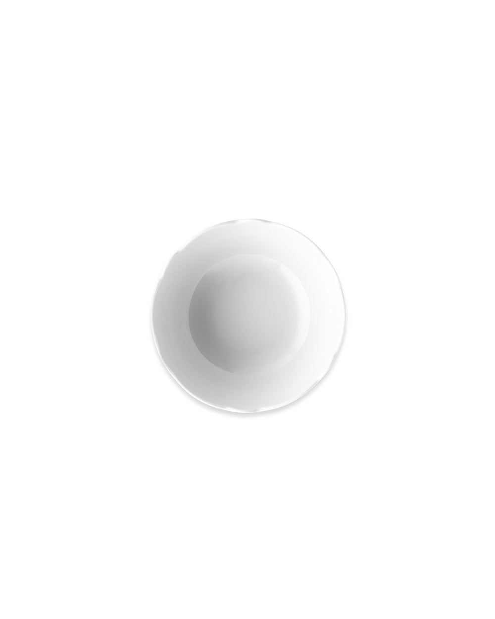 White bowl by Alessi with a subtle wavy rim, shown from a top-down perspective.