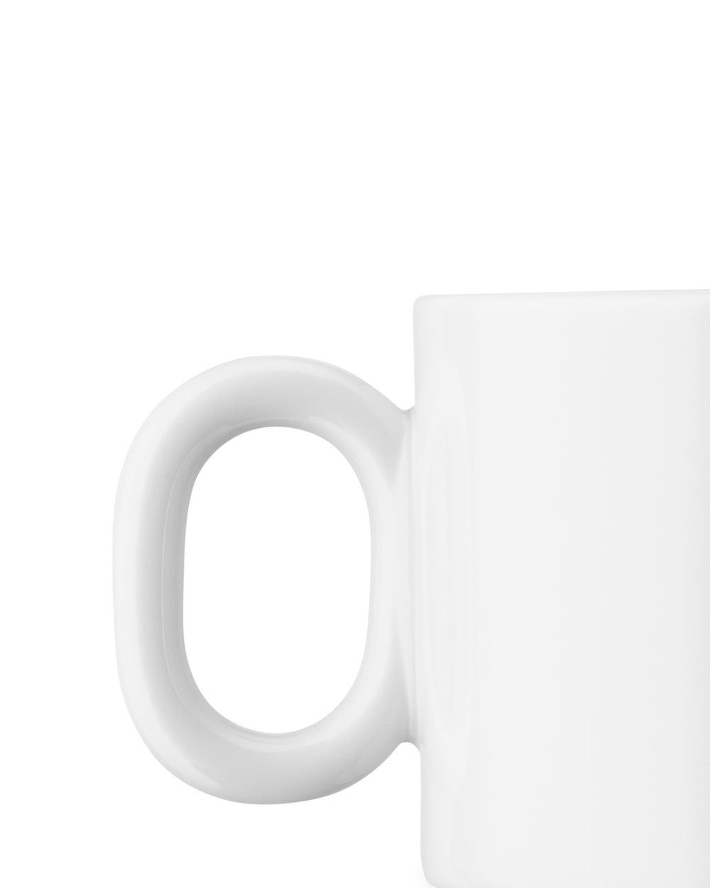 White ceramic mug by Alessi, cropped close-up side view showing handle.