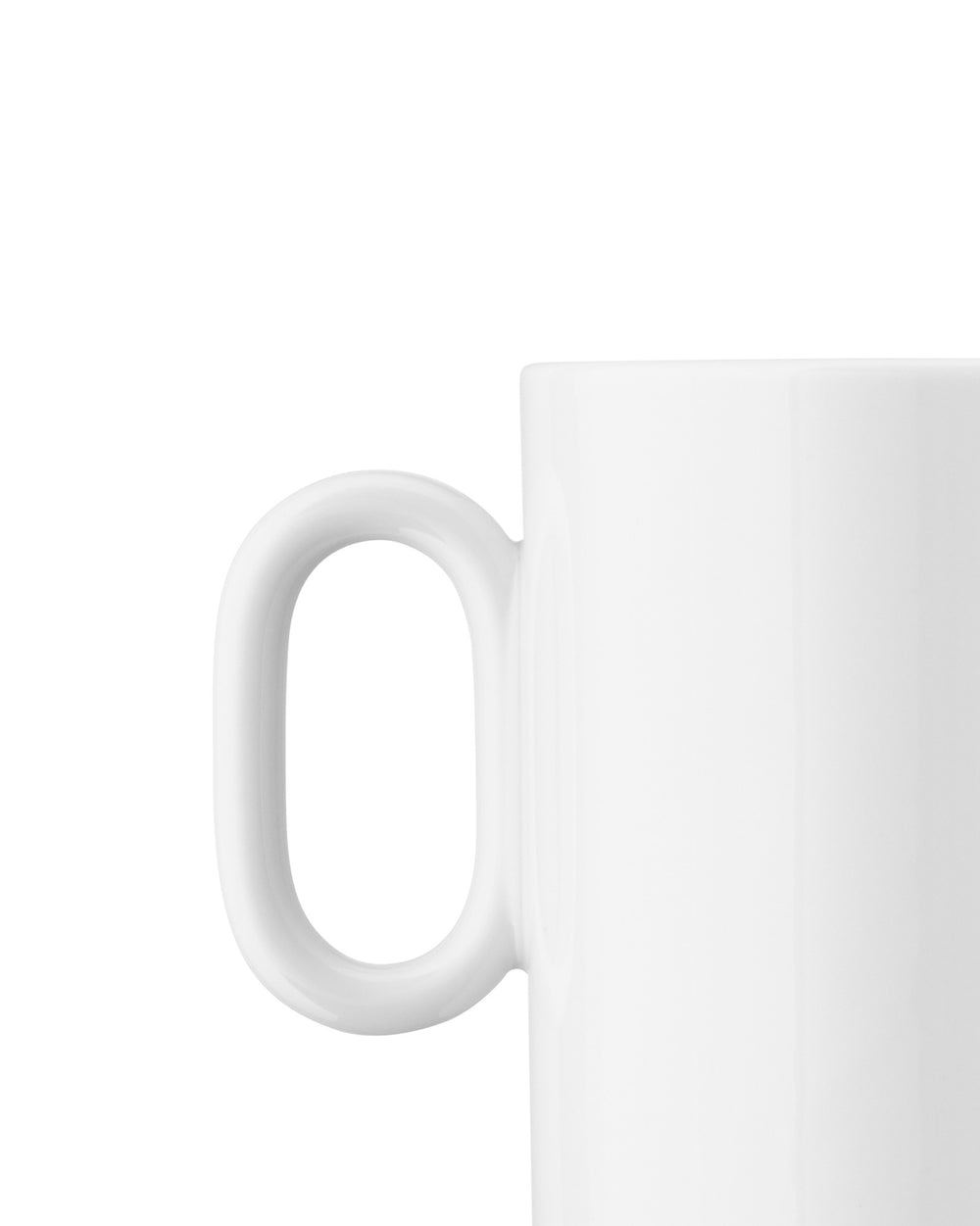 White ceramic mug by Alessi, featuring a smooth, rounded handle in a cropped side view.