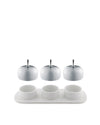White porcelain condiment serving set by Alessi with a patterned tray and three domed chrome lids.