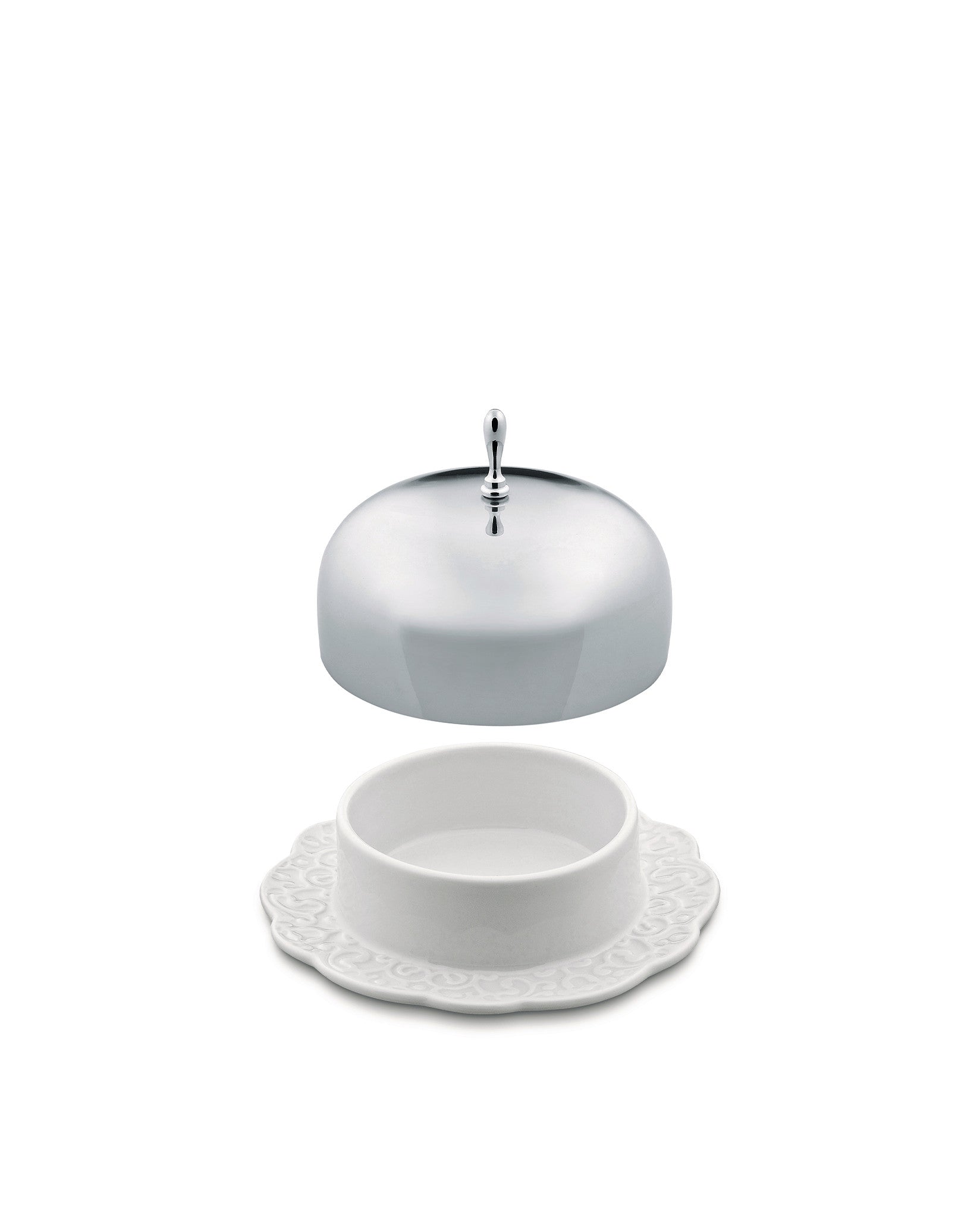 White ceramic butter dish by Alessi with a shiny domed silver lid floating above an ornate embossed base.