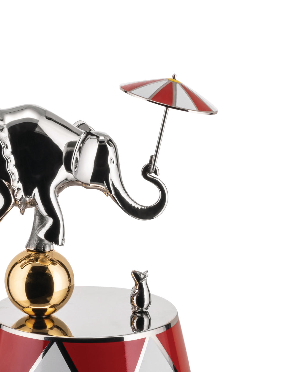 Shiny silver decorative circus figure by Alessi, featuring an elephant on a gold ball, a mouse, and a red and white striped umbrella.