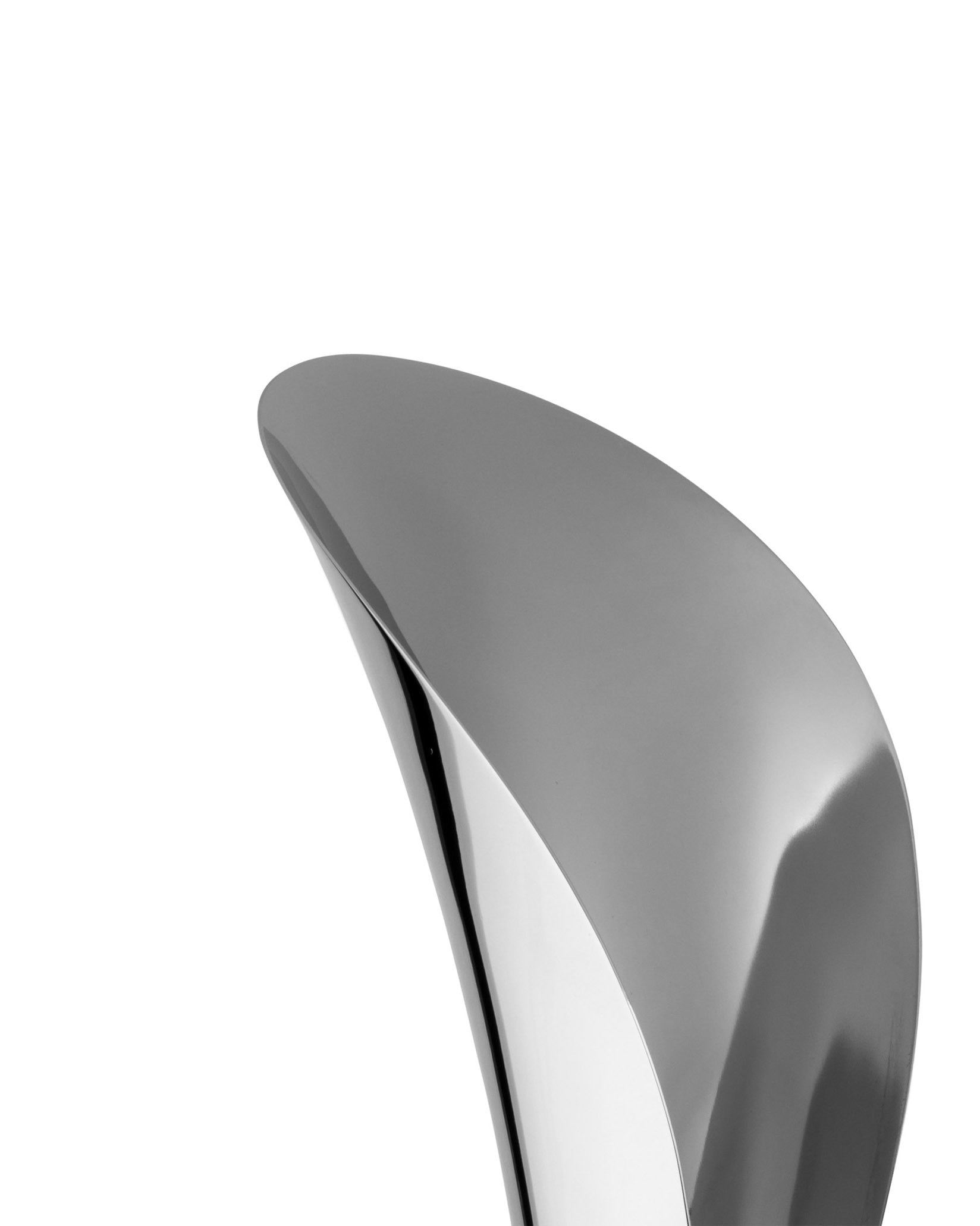 Polished silver-toned Lily serving scoop by Alessi, with a sleek, abstract curved design, isolated on white.