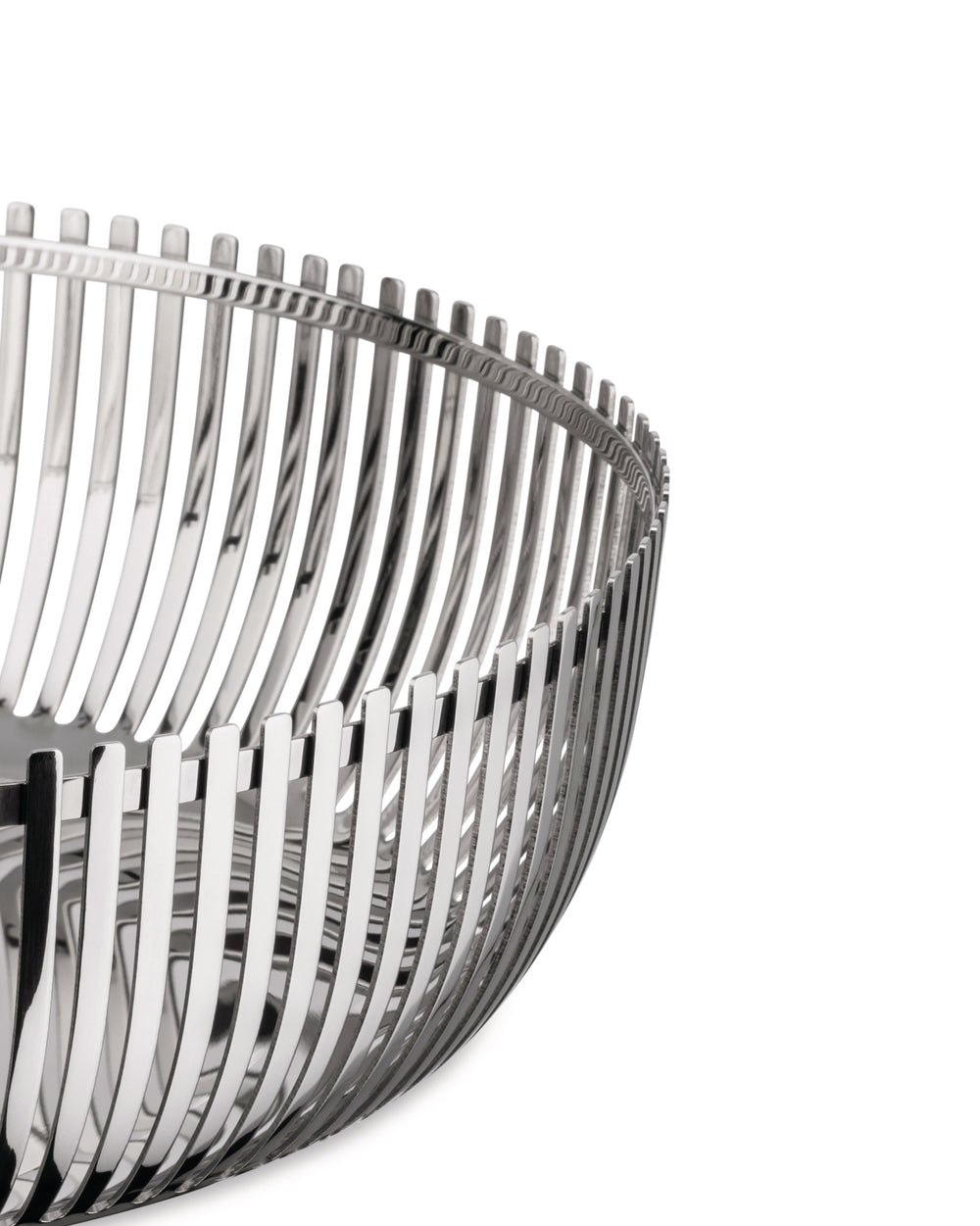 Polished silver metal decorative basket by Alessi with an open slatted, curved design, close-up.