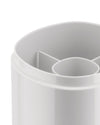 White plastic compartmental organizer by Alessi, captured in a close-up showing rounded edges and internal dividers.
