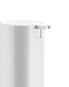 White pump dispenser by Alessi with a sleek, minimalist design and rectangular nozzle, cropped view.