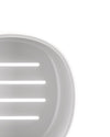 Light gray oval slotted soap dish by Alessi with a smooth, slightly translucent finish, cropped close-up.