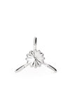 Silver metallic Juicy Salif citrus squeezer by Alessi, featuring a sculptural tripod design and fluted reamer.