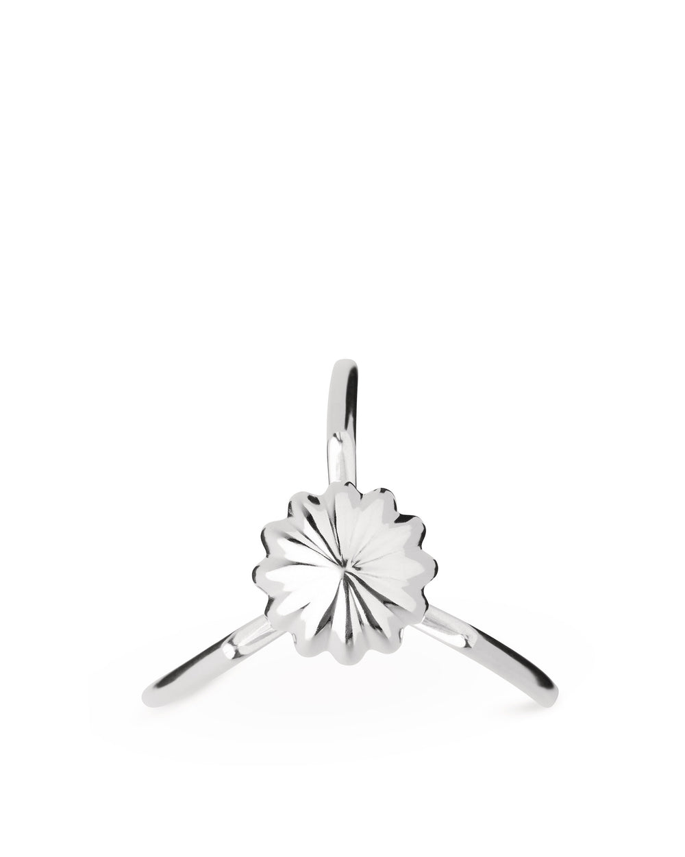 Silver metallic Juicy Salif citrus squeezer by Alessi, featuring a sculptural tripod design and fluted reamer.