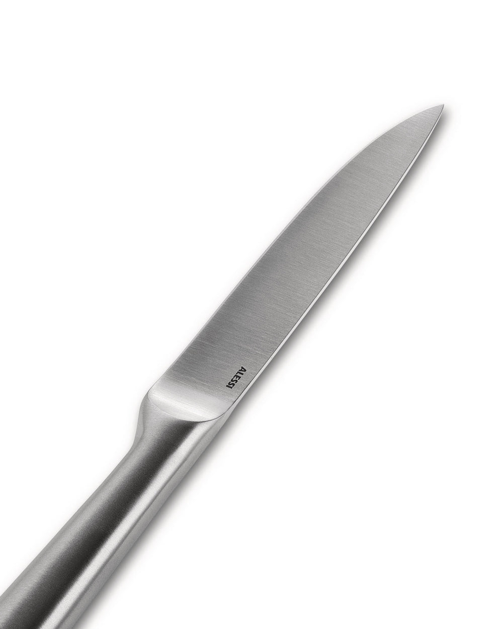 Silver stainless steel knife by Alessi with a brushed finish and engraved logo, angled on white.