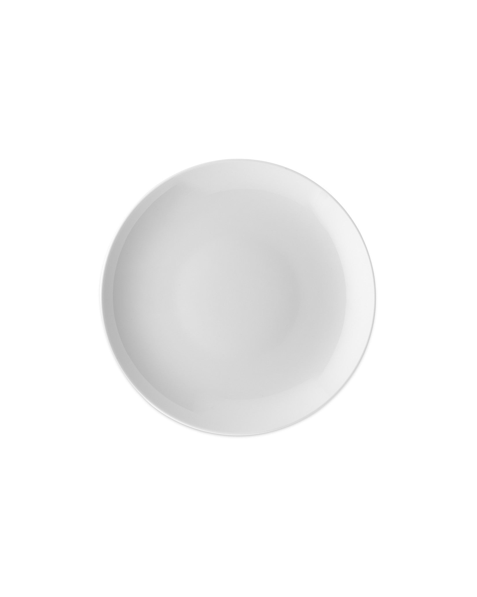 White round plate by Alessi with a simple, plain surface, viewed from above.