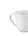 White ceramic mug by Alessi, with a clean design and curved handle, shown in a cropped side view.