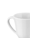 Cropped white ceramic mug by Alessi with a glossy finish and visible handle.