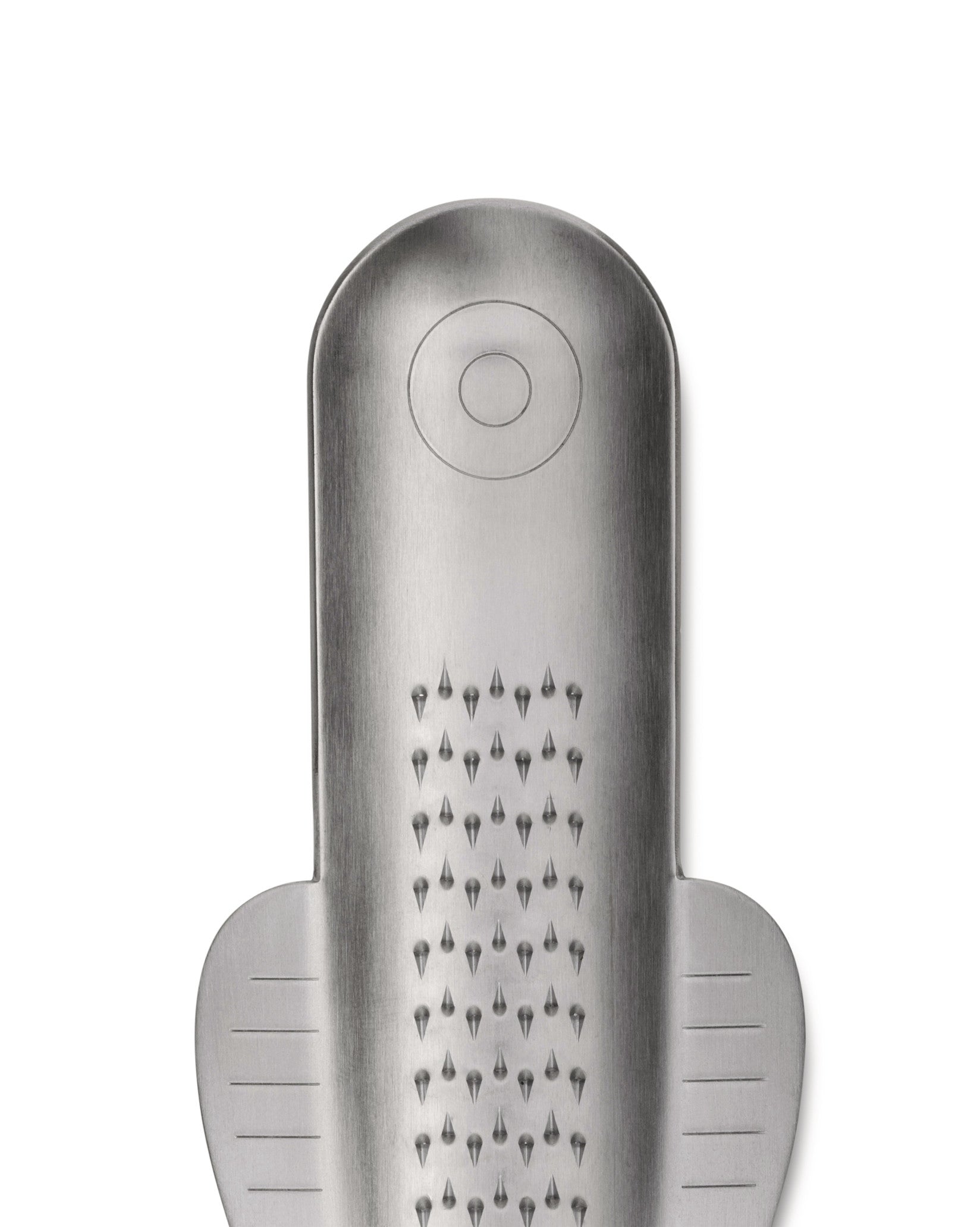 Brushed stainless steel grater by Alessi, with pointed teeth, a circular top detail, and side measurement lines.