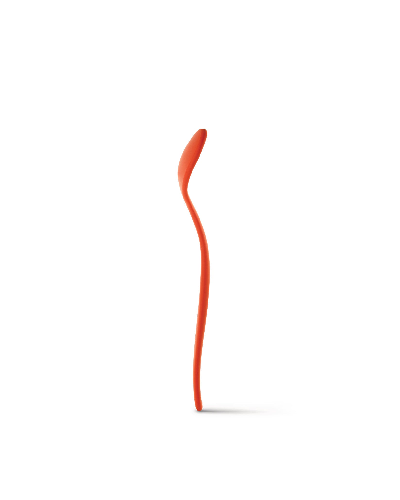 Orange serving spoon by Alessi, with a tall, curved handle and heart-shaped scoop, standing upright.