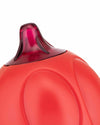 Matte red sugar dispenser by Alessi with a translucent dark red pouring spout and sculpted, curved details.