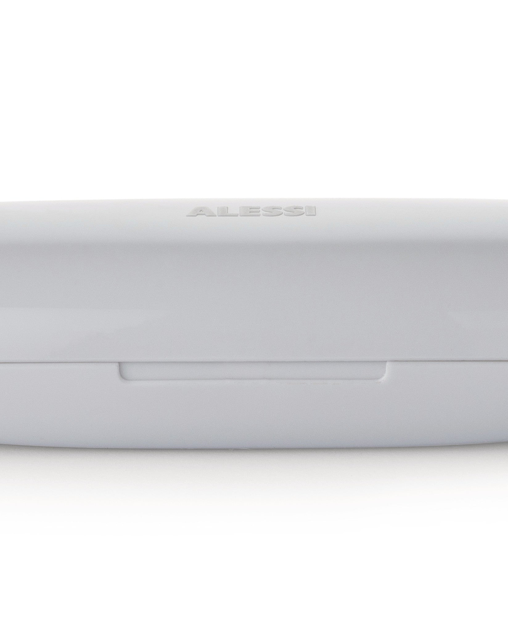 Light gray food container by Alessi, embossed with the brand logo and a visible lid seam.