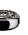 Silver metal Spirale bowl by Alessi with a polished exterior and intricate coiled wire interior, close up.