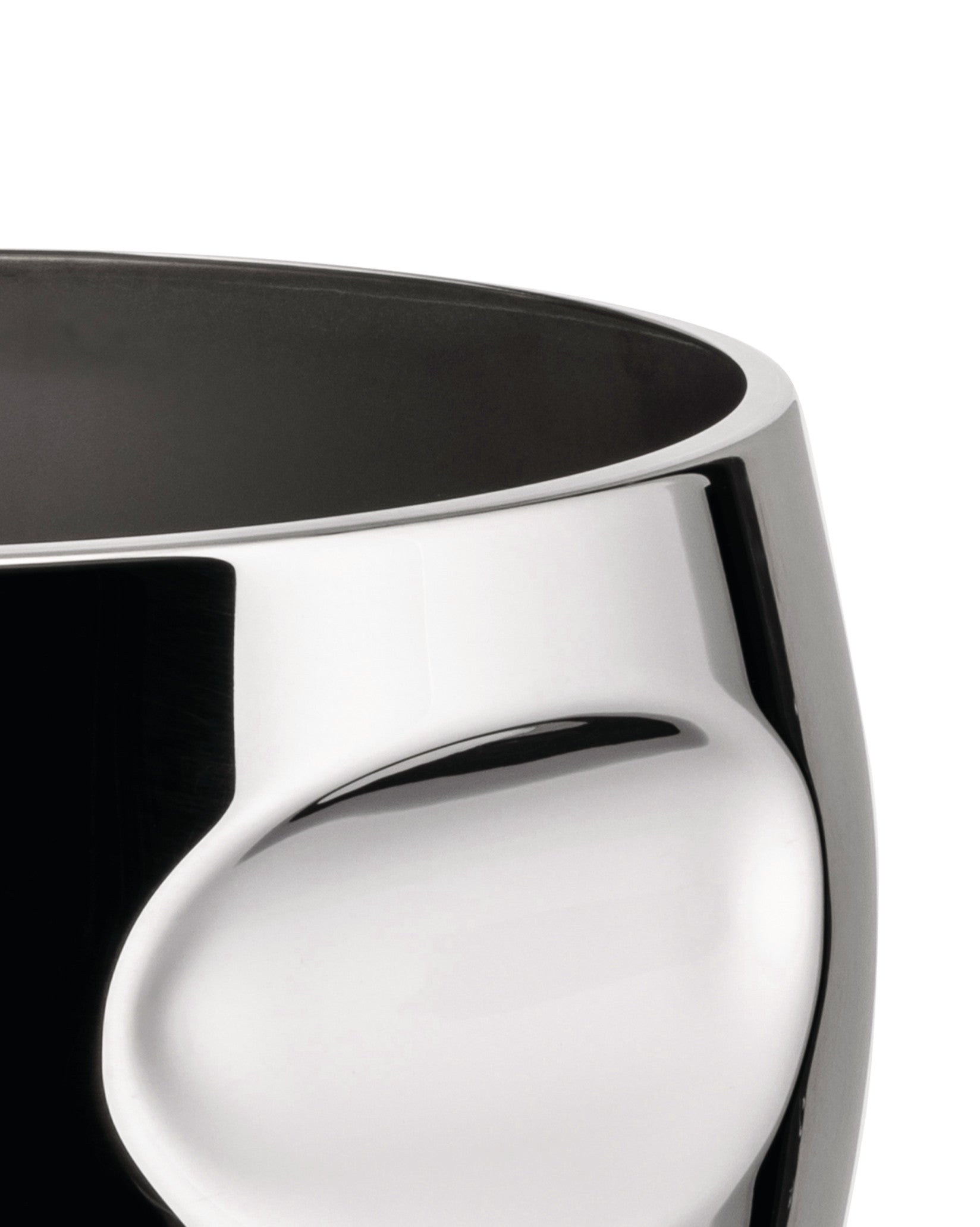 Cropped polished chrome vessel by Alessi, with a dark interior and undulating, sculptural exterior.