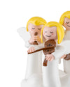 Three white angel ornamental figurines by Alessi, with yellow hair, playing brown flute and violin instruments.