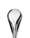 Silver-toned, sculptural serving spoon by Alessi, highly reflective and elongated, cropped against a white background.