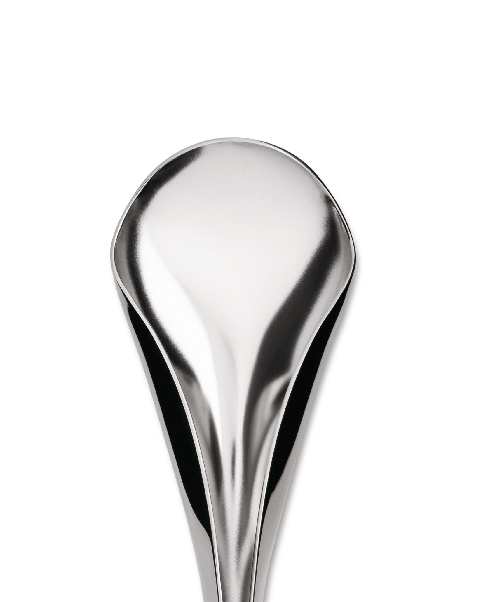 Silver-toned, sculptural serving spoon by Alessi, highly reflective and elongated, cropped against a white background.