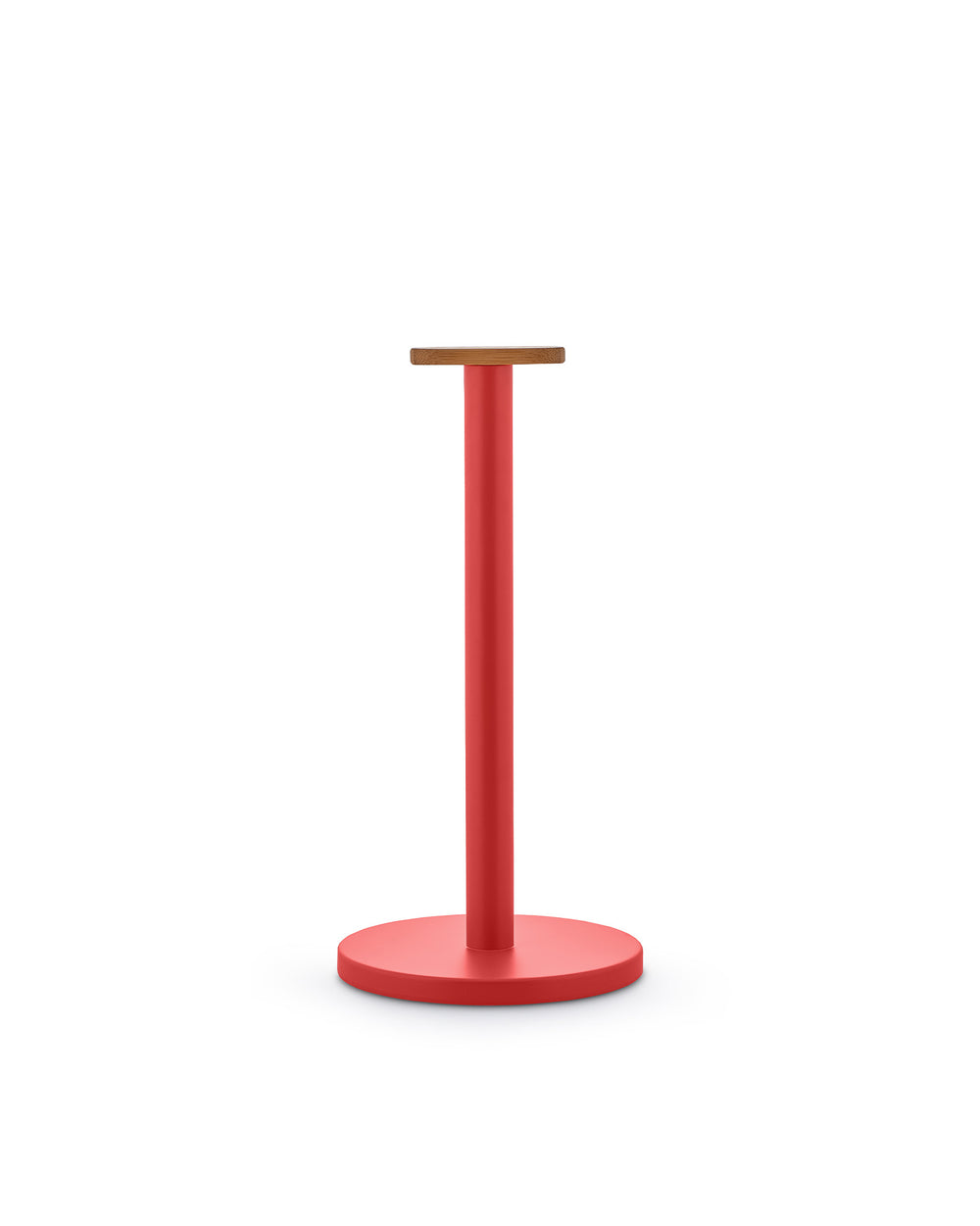 Red metal paper towel holder by Alessi with a round wooden top, cylindrical post, and round base.
