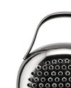 Silver metal cheese grater by Alessi, with a curved handle and perforated surface, close-up.