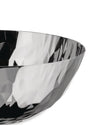 Faceted silver metallic bowl by Alessi, featuring a geometric, highly reflective surface in a cropped view.