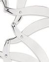 Silver metal trivet by Alessi, featuring interlocking curved arms with a shiny, reflective surface, cropped close-up.