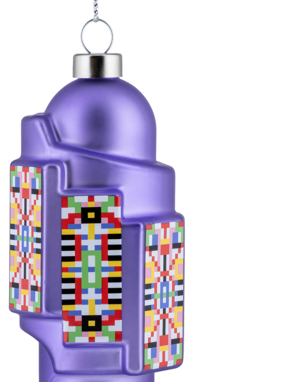 Purple lantern-shaped Christmas tree ornament by Alessi with a dome top and colorful geometric patterns.