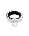 Silver-colored metal ring by Alessi with a black interior band and a clear faceted gem.