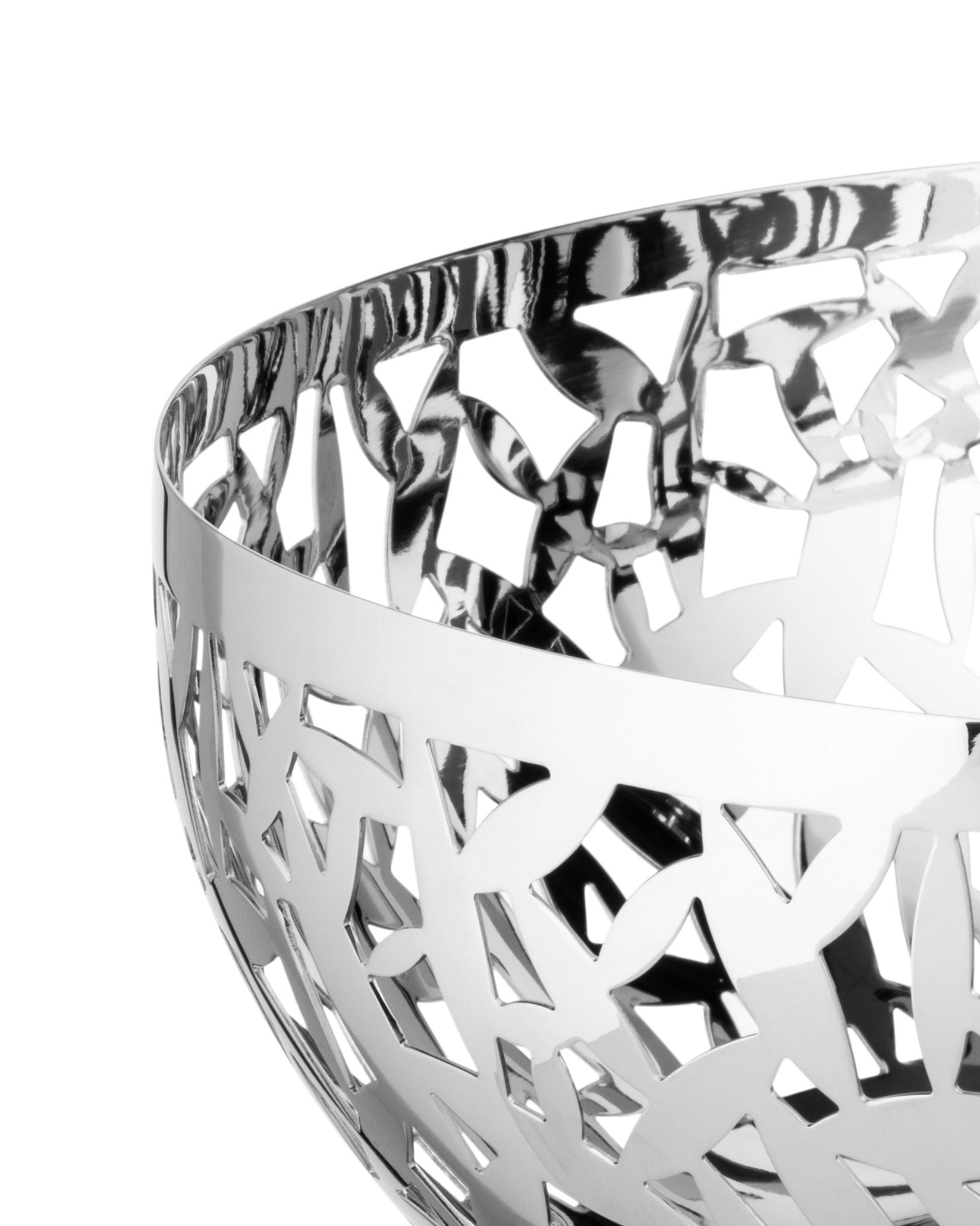 Polished silver metal decorative bowl by Alessi with an intricate cutout geometric pattern.