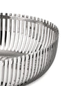 Silver metal basket by Alessi with vertical slats and a textured top rim, shown cropped.