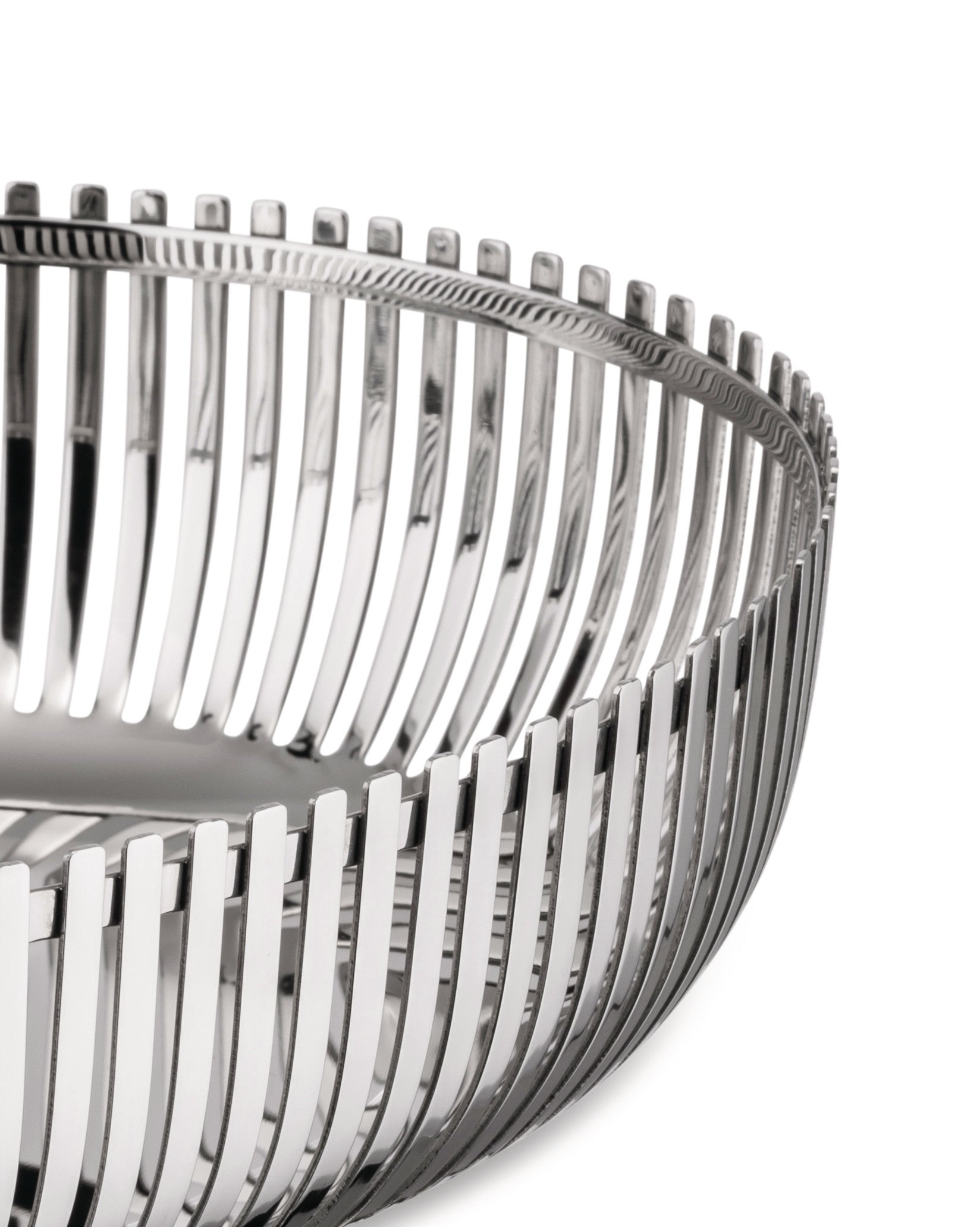 Silver metal basket by Alessi with vertical slats and a textured top rim, shown cropped.