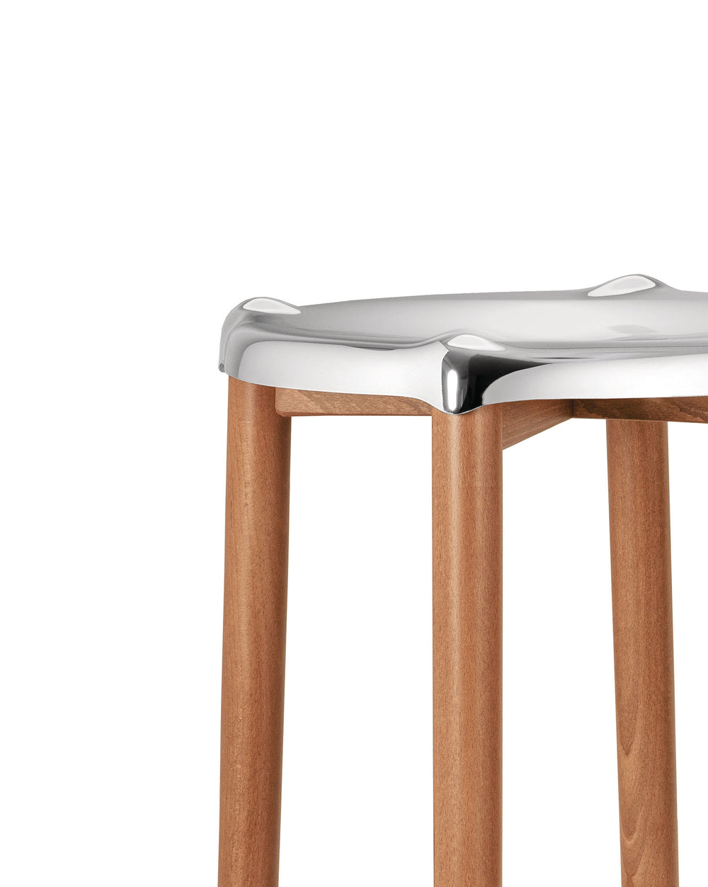 Silver metallic stool with light brown wooden legs by Alessi, featuring a contoured seat, cropped view.